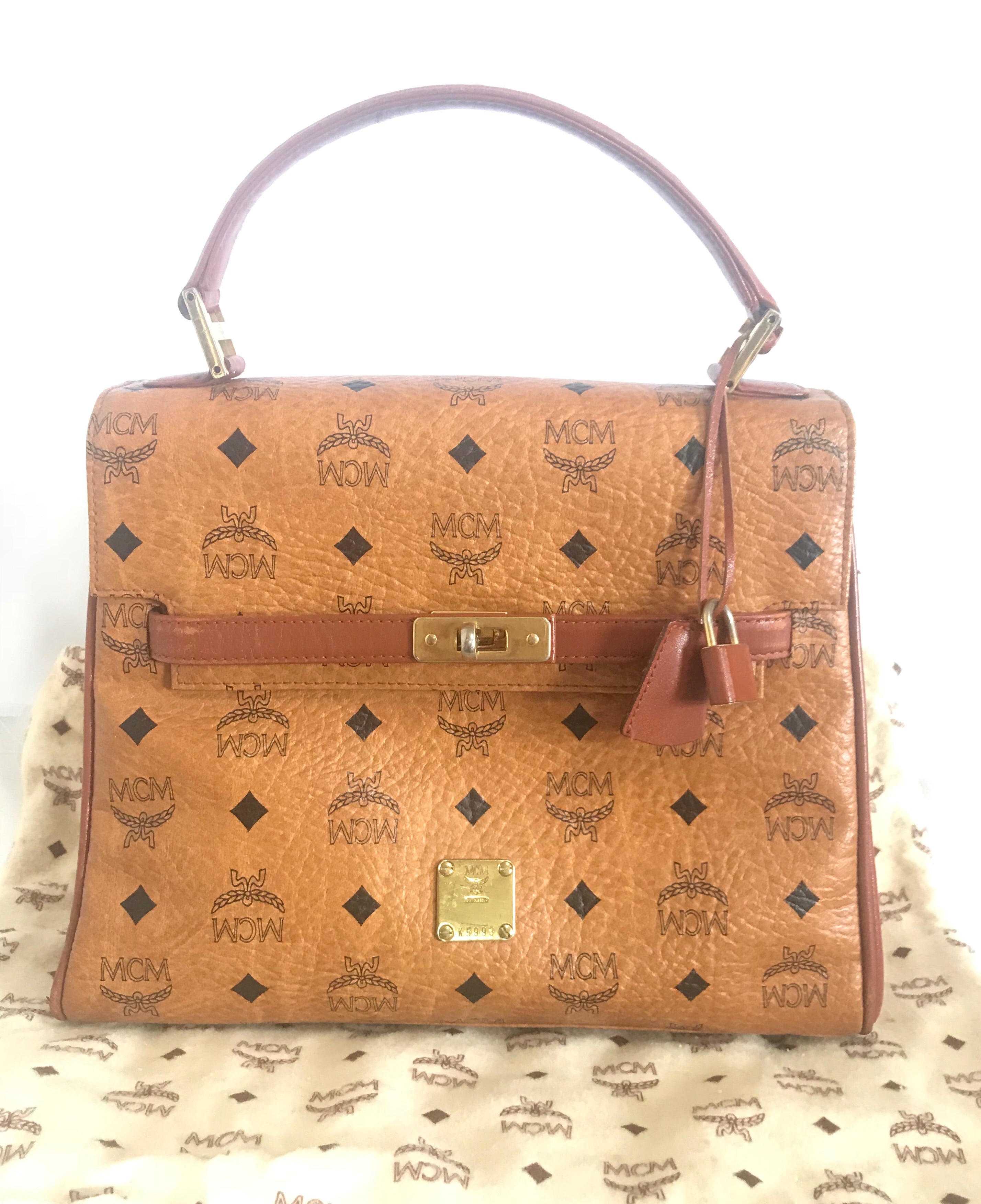 Vintage MCM classic brown monogram Kelly bag with golden logo plate. Perfect daily use bag.  By Michael Cromber, Germany