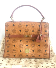 Vintage MCM classic brown monogram Kelly bag with golden logo plate. Perfect daily use bag.  By Michael Cromber, Germany
