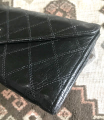 1980s. Vintage CHANEL black goatskin bill, card, checkbook long wallet pouch purse with  mini CC motif.  Classic unisex style.