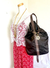 Vintage Paloma Picasso brown satin logo jacquard hobo shoulder bag with leather trimmings and golden logo charm. Classic bag for daily use.