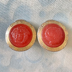 Vintage Gianni Versace orange candy earrings with gold tone frames and Medusa face. Rare jewelry piece. 0407283
