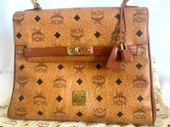 Vintage MCM classic brown monogram Kelly bag with golden logo plate. Perfect daily use bag.  By Michael Cromber, Germany