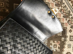 1990s. Vintage Bottega Veneta classic black lamb leather intrecciato handbag with golden closure hock. Gorgeous masterpiece from Bottega.
