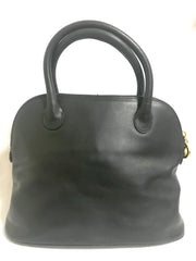 Vintage Paloma Picasso black leather bolide bag style handbag with iconic golden logo motif. Classic shape bag.