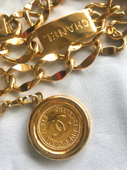 Vintage CHANEL golden thick chain belt with logo engraved bar motifs and a round charm to the end. Must have gorgeous accessory.
