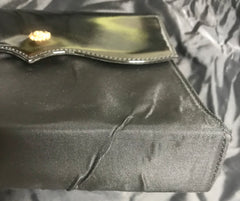 Vintage Christian Lacroix black patent enamel and nylon combo clutch bag with a sun flower shape logo motif.