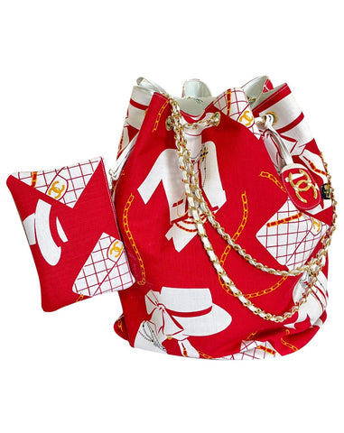 Vintage CHANEL red and white canvas large hobo shoulder bag with supermodel print and CC charm. Mademoiselle. 0407231