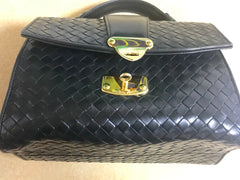 1990s. Vintage Bottega Veneta classic black lamb leather intrecciato handbag with golden closure hock. Gorgeous masterpiece from Bottega.