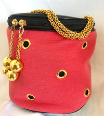 Vintage Moschino by Redwall lunchbox design red jersey and black leather handbag with golden eyelets and ball charms. 0506289