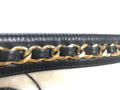 1980s. Vintage CHANEL black lamb leather belt bag, waist bag, fanny pack with golden chain belt & CC closure.  Belt size good for 23.8" through 26.2" (60.5-66.5cm)