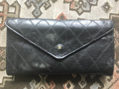 1980s. Vintage CHANEL black goatskin bill, card, checkbook long wallet pouch purse with  mini CC motif.  Classic unisex style.