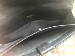 1980s. Vintage CHANEL black goatskin bill, card, checkbook long wallet pouch purse with  mini CC motif.  Classic unisex style.