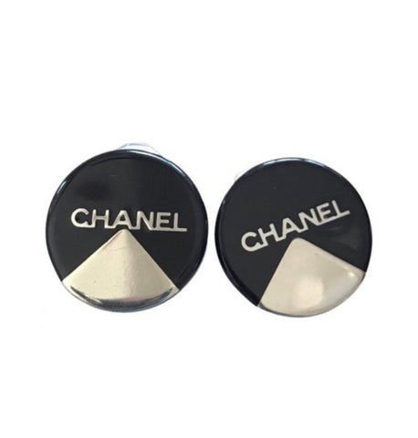 Vintage Chanel round earrings with silver and black mod design.
