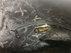 Vintage Paloma Picasso black leather bolide bag style handbag with iconic golden logo motif. Classic shape bag.