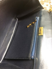 Vintage Nina Ricci navy leather clutch chain shoulder bag, classic purse with golden ribbon logo motif. Mod and chic daily purse.