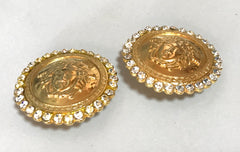 Vintage Gianni Versace large round gold tone medusa face earrings with crystal glasses. Must have Lady Gaga style jewelry piece.