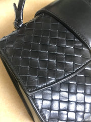 1990s. Vintage Bottega Veneta classic black lamb leather intrecciato handbag with golden closure hock. Gorgeous masterpiece from Bottega.