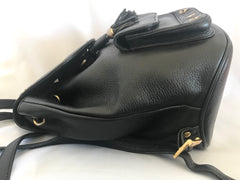 Vintage MCM black backpack with golden studded logo motifs and drawstrings. Designed by Michael Cromer. Unisex bag for daily use.