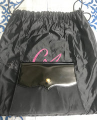 Vintage Christian Lacroix black patent enamel and nylon combo clutch bag with a sun flower shape logo motif.