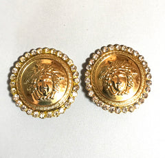 Vintage Gianni Versace large round gold tone medusa face earrings with crystal glasses. Must have Lady Gaga style jewelry piece.
