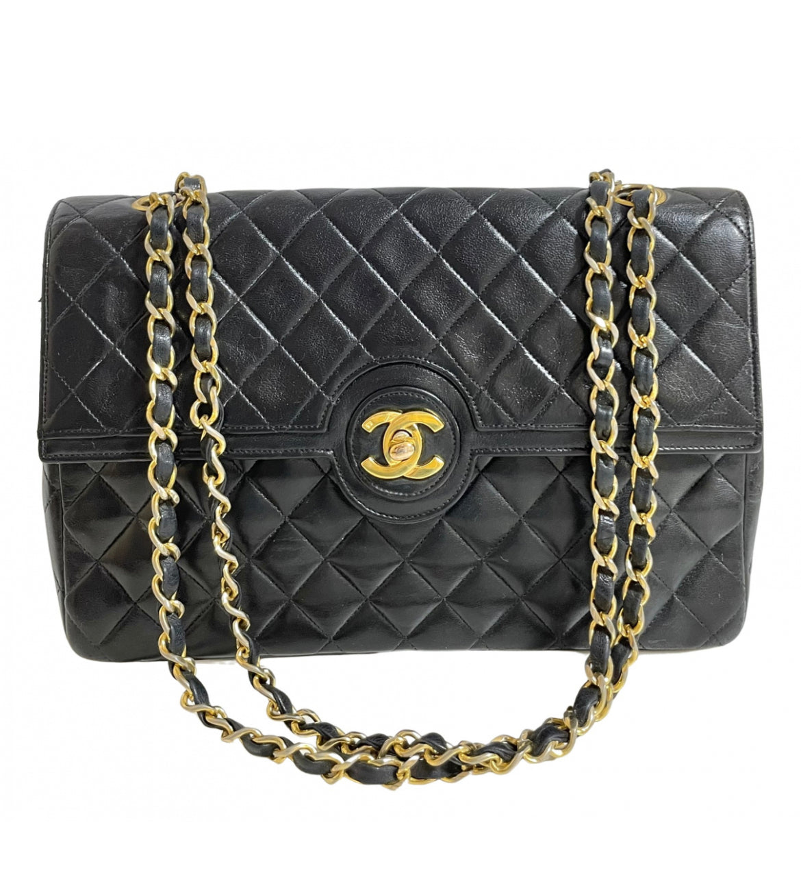 80's vintage Chanel black 2.55 shoulder bag with circle CC  flap design. Rare piece from the era. 0410283
