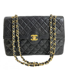 80's vintage Chanel black 2.55 shoulder bag with circle CC  flap design. Rare piece from the era. 0410283