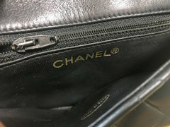 1980s. Vintage CHANEL black lamb leather belt bag, waist bag, fanny pack with golden chain belt & CC closure.  Belt size good for 23.8" through 26.2" (60.5-66.5cm)