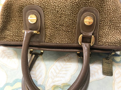 Vintage Borbonese by red wall, brown and beige leather classic bag with golden logo charm.  Unisex use. Masterpiece.