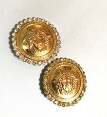 Vintage Gianni Versace large round gold tone medusa face earrings with crystal glasses. Must have Lady Gaga style jewelry piece.