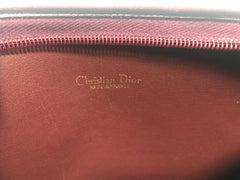 Vintage Christian Dior wine red leather clutch shoulder bag with engraved logo at center. Classic and beautiful purse. 060905r4