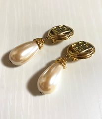 Vintage Givenchy golden round dangle earrings with teardrop faux pearl. Classic and beautiful jewelry piece.