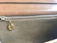 Vintage Christian Dior tanned brown leather shoulder clutch bag with golden CD motif.