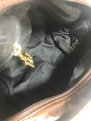 Vintage Moschino soft brown leather drum shape shoulder bag with iconic Question marks. Moschino by Redwall. Made in Italy. 060724r1 Moschino by Redwall. Made in Italy.