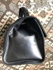 1990s. Vintage Bottega Veneta classic black lamb leather intrecciato handbag with golden closure hock. Gorgeous masterpiece from Bottega.