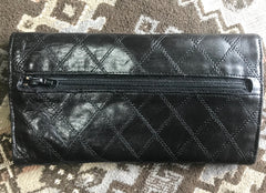 1980s. Vintage CHANEL black goatskin bill, card, checkbook long wallet pouch purse with  mini CC motif.  Classic unisex style.