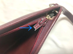 Vintage Christian Dior wine red leather clutch shoulder bag with engraved logo at center. Classic and beautiful purse. 060905r4