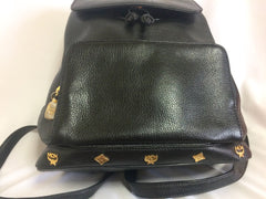 Vintage MCM black leather backpack with golden studded logo motifs. Designed by Michael Cromer. Unisex bag for daily use.