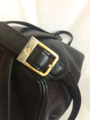 Vintage MCM black leather backpack with golden studded logo motifs. Designed by Michael Cromer. Unisex bag for daily use.