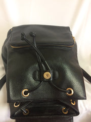 Vintage MCM black leather backpack with golden studded logo motifs. Designed by Michael Cromer. Unisex bag for daily use.