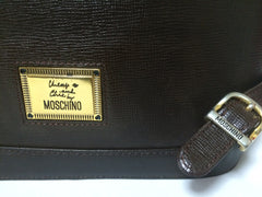 Vintage MOSCHINO genuine dark brown leather backpack with golden and black M logo motif from cheap and chic by moschino. Perfect daily bag. 060528r1