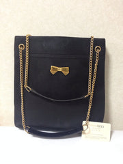 Vintage Nina Ricci black tote bag with golden chain straps with golden logo bow, ribbon shape motif. Perfect daily purse