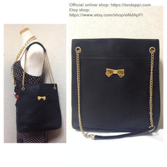 Vintage Nina Ricci black tote bag with golden chain straps with golden logo bow, ribbon shape motif. Perfect daily purse
