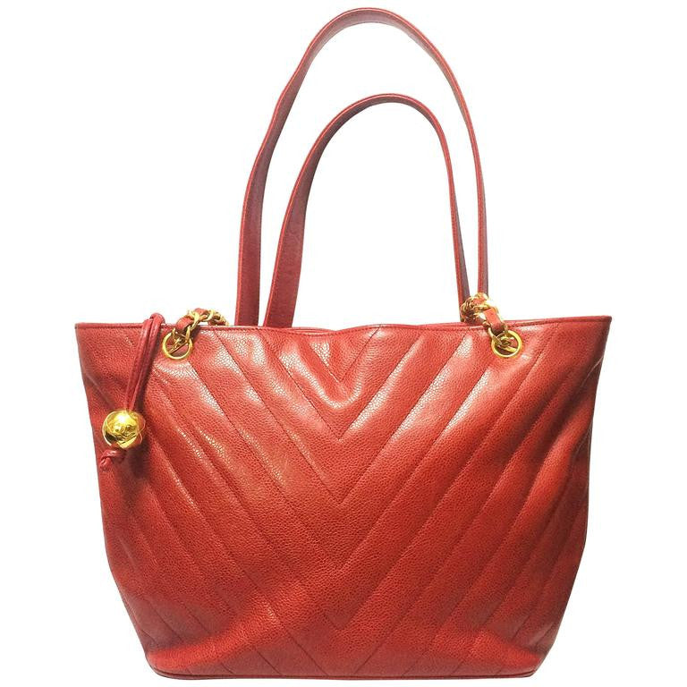 Vintage CHANEL red caviarskin v stitch, chevron style chain shoulder tote bag with golden CC ball charm. Classic purse for daily use.