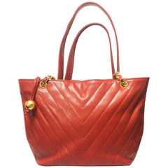 Vintage CHANEL red caviarskin v stitch, chevron style chain shoulder tote bag with golden CC ball charm. Classic purse for daily use.