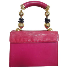 Vintage Gianni Versace pink calf leather and genuine snakeskin handbag with golden and black balls handles.